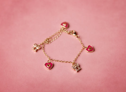 Gold bracelet with heart-shaped charms