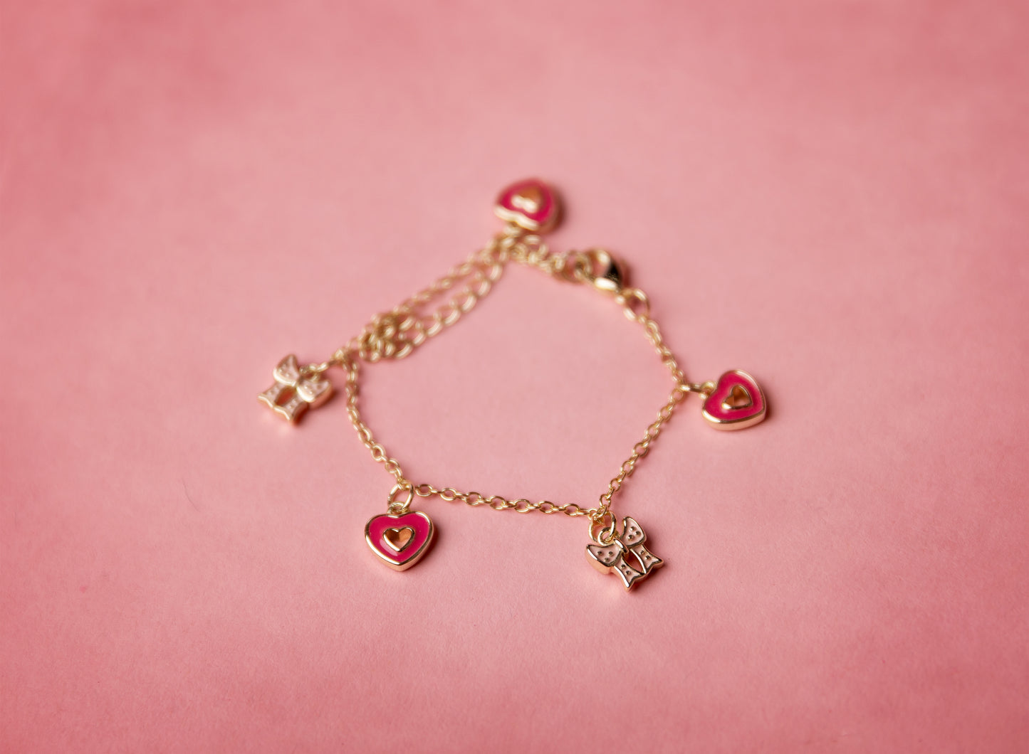 Gold bracelet with heart-shaped charms
